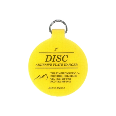 a yellow disc plate hanger