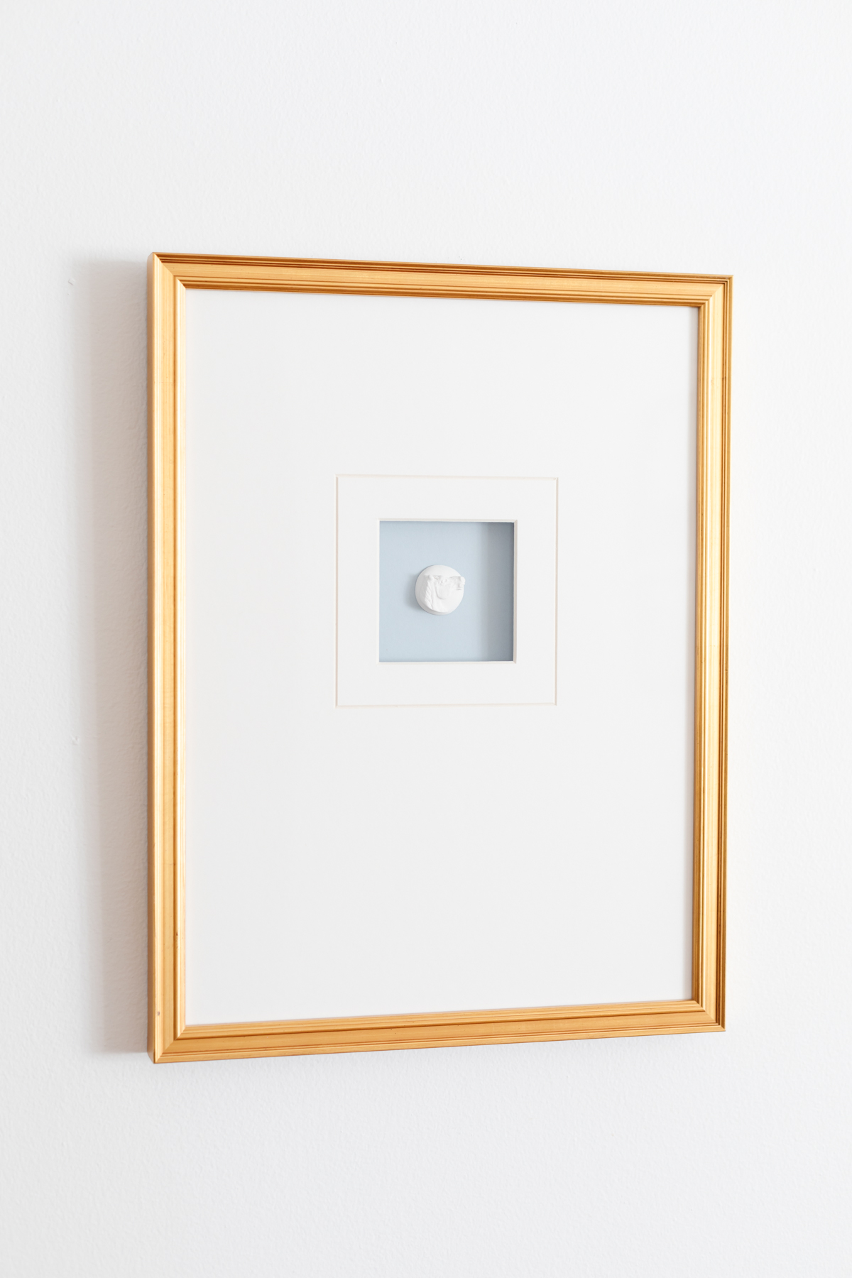 A framed intaglio in an entryway design