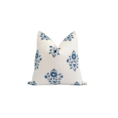 a blue and white block print pillow