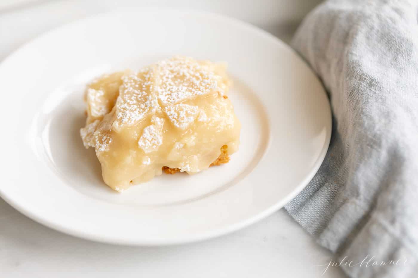 gooey butter cake on a plate with a napkin