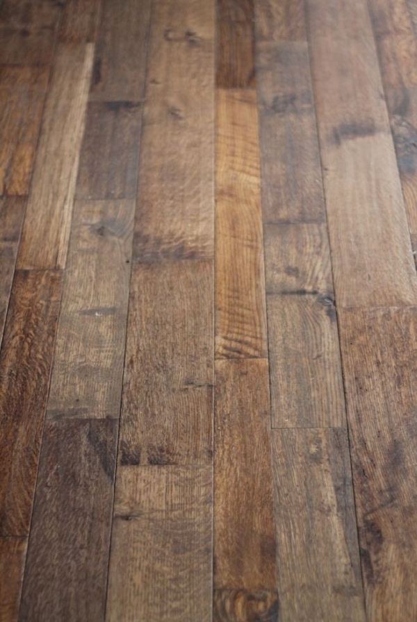 An image of dark stained hand scraped wood floors
