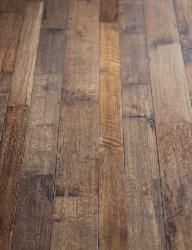 An image of dark stained hand scraped wood floors