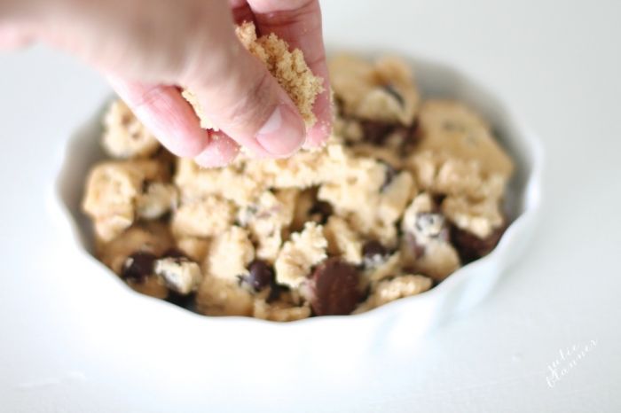 Salted caramel chocolate chip cobbler in a white dish.