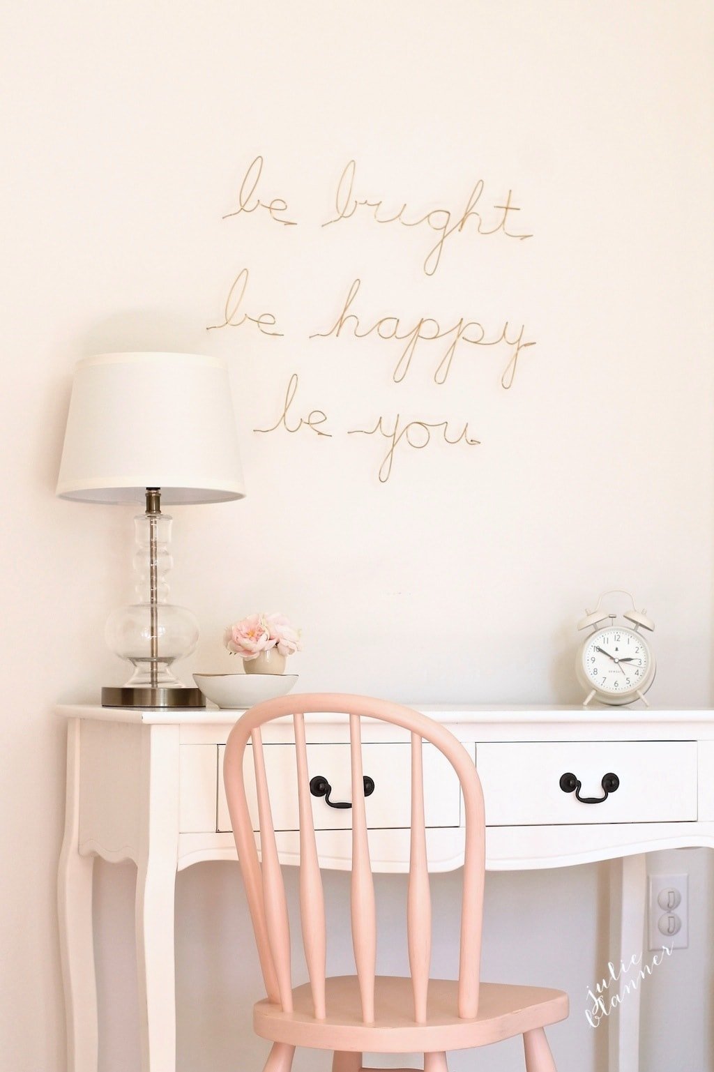 Girl bedroom with white walls and a desk painted in SW 1072