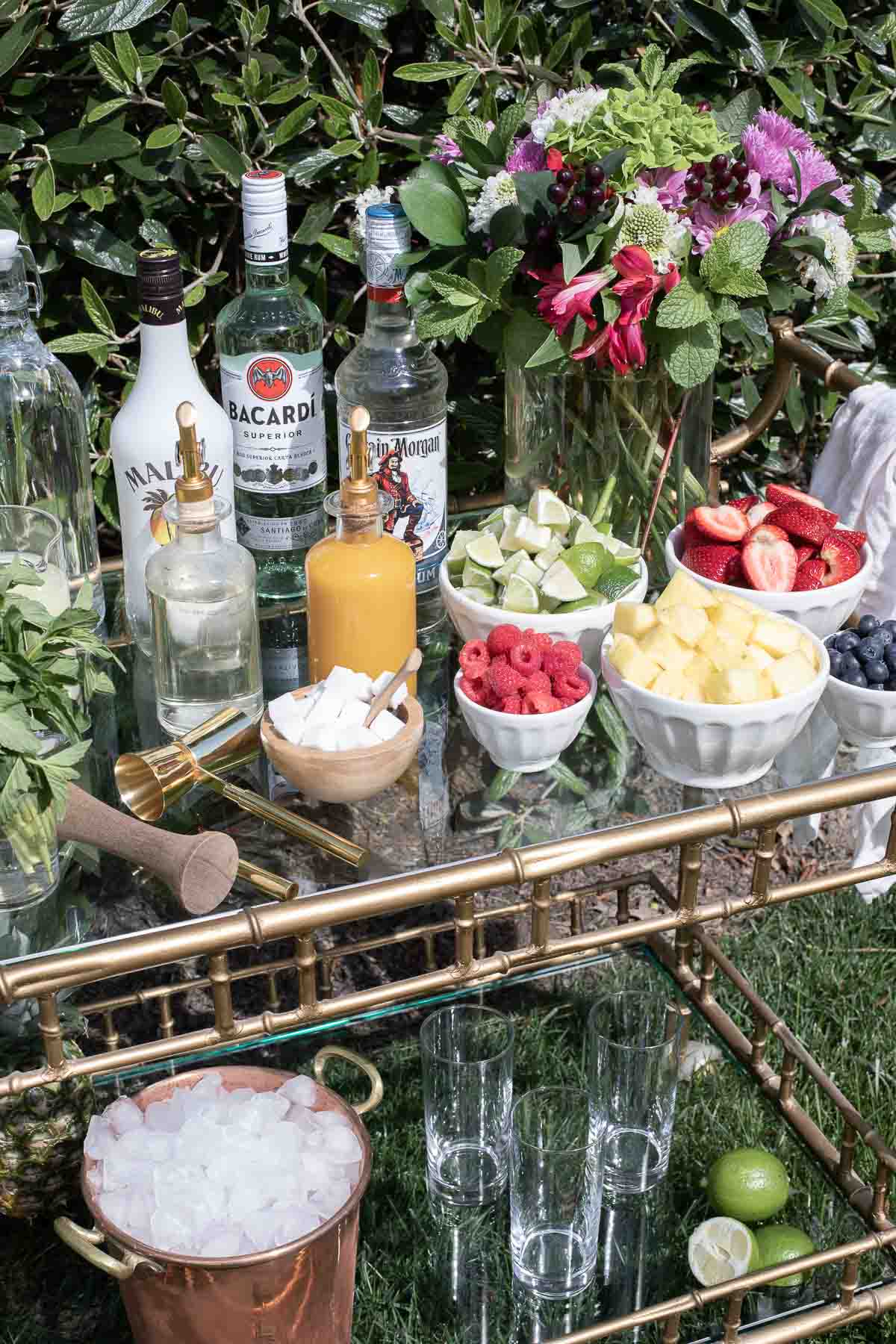 A bar cart styled with a self serve mojito set-up.