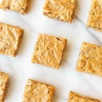 homemade pecan pie bars with graham cracker crust on marble countertop