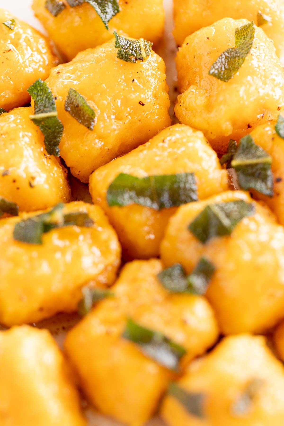 A close up shot of a homemade sweet potato gnocchi recipe
