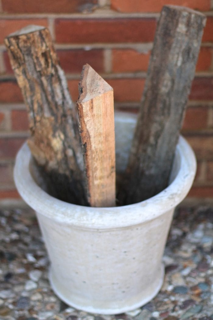 Logs standing upright in the outdoor planter