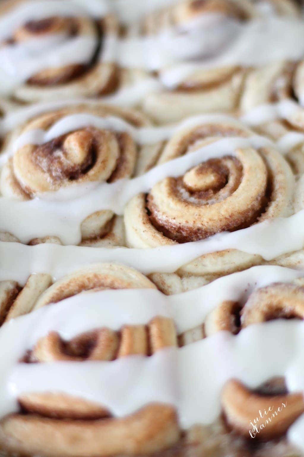 cinnamon rolls drizzled with cream cheese icing