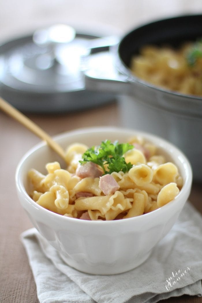 The best baked Truffle Mac and Cheese with Smoked Gouda is an easy side dish or entree that's creamy and full of flavor! Simply decadent and delicious. truffle mac and cheese in a white bowl with gold spoon