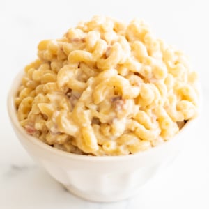 A white bowl of gouda mac and cheese.