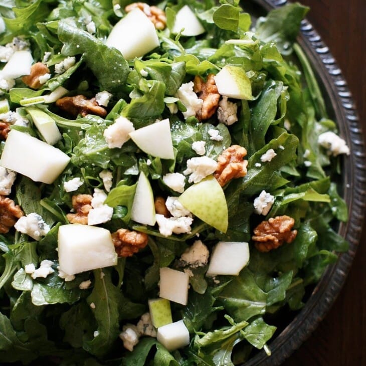 pear and walnut salad with gorgonzola on a silver platter