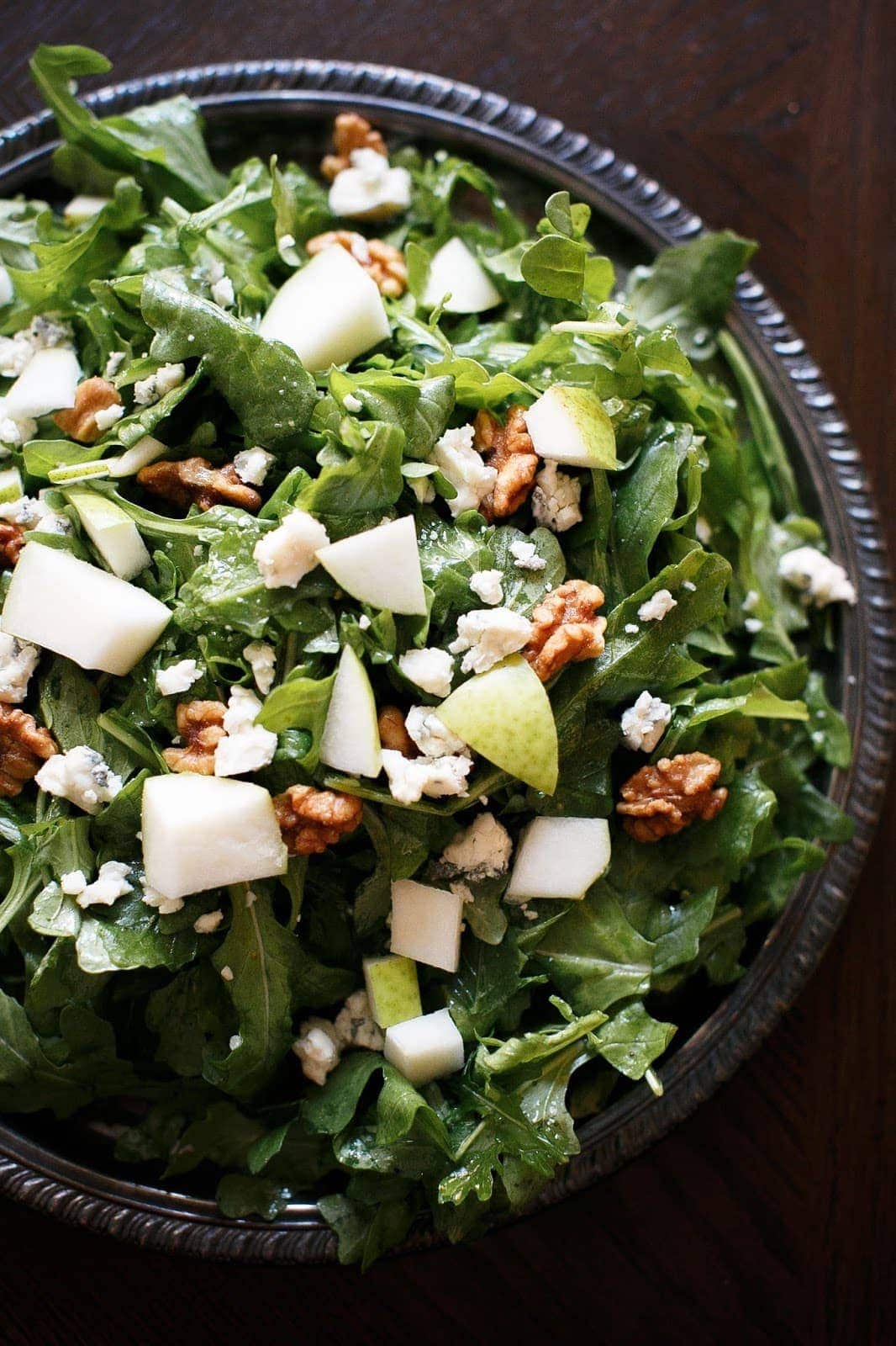 pear and walnut salad with gorgonzola on a silver platter