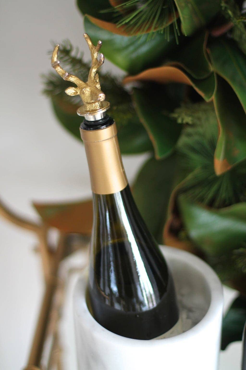 Gilded stag head wine cork