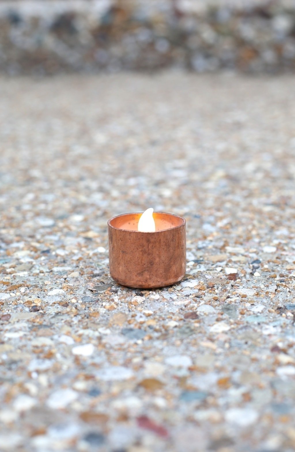A small, copper candle
