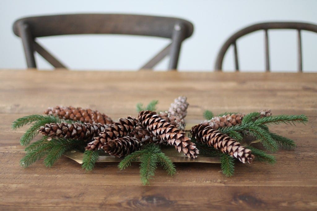 brass candlesticks and pine cones (before greenery)