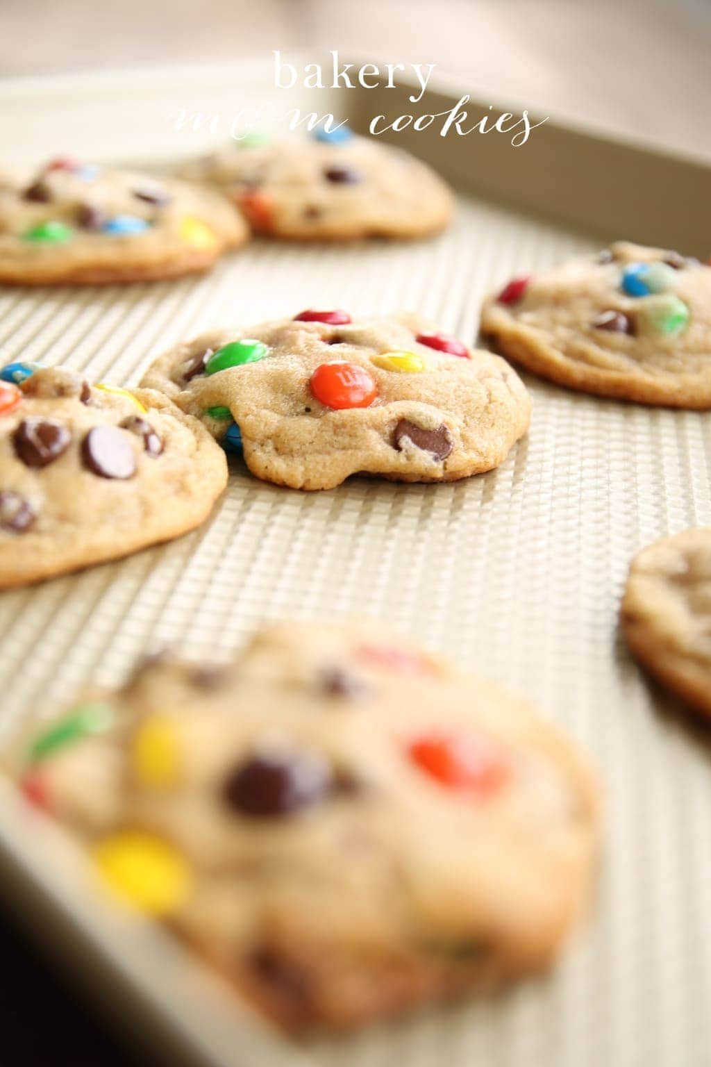 M and M cookies on a cooling rack. 