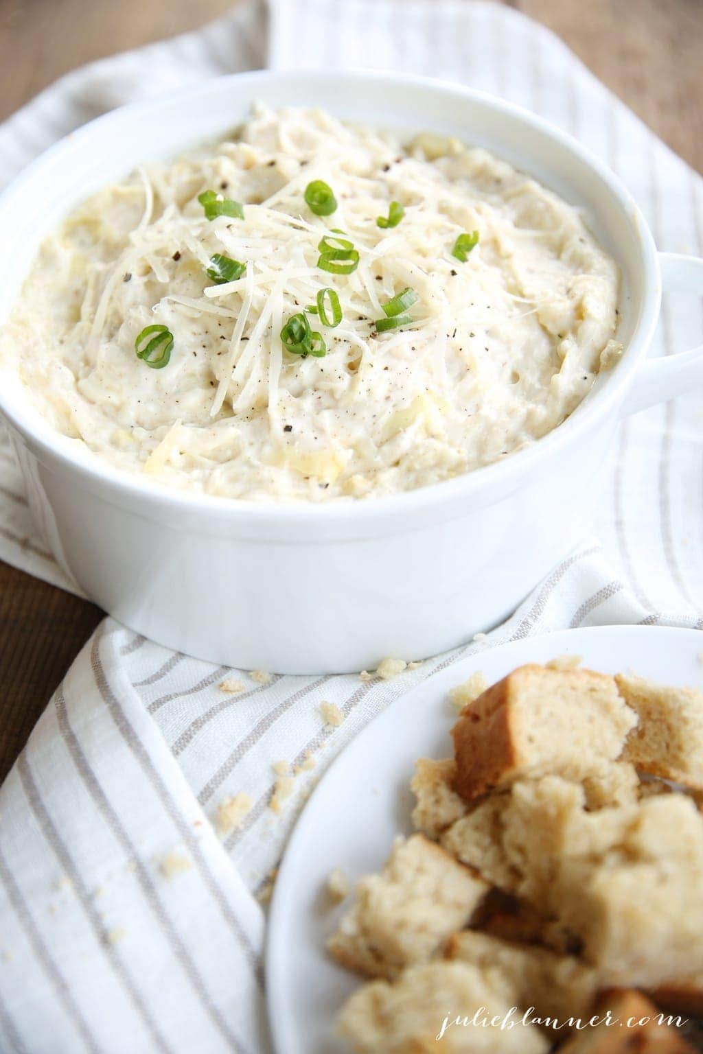 A white bowl filled with a cheesy easy dip recipe