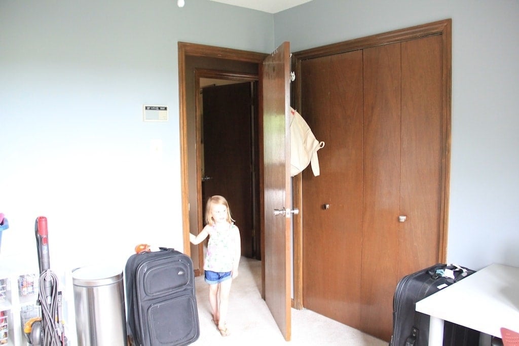 girl in room with dated doors