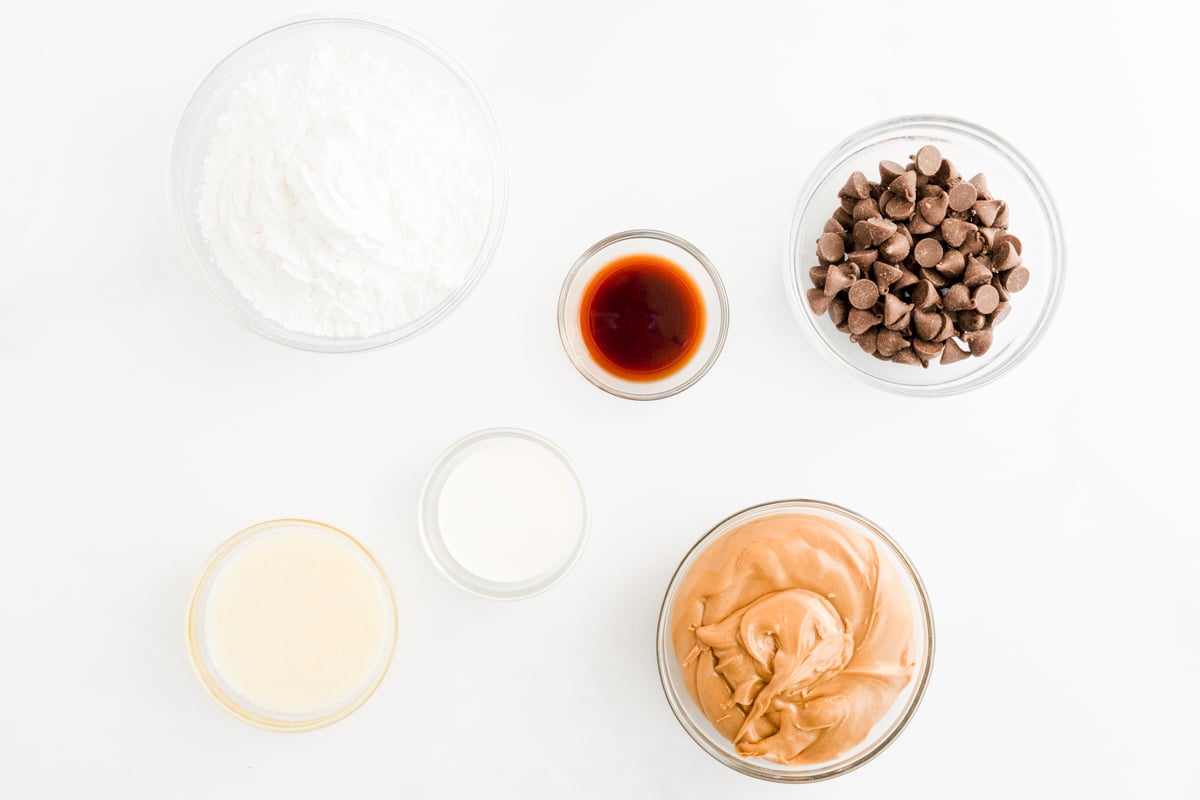 Ingredients for peanut butter truffles laid out on a white surface