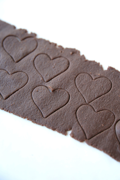 A homemade piece of chocolate with hearts on it.