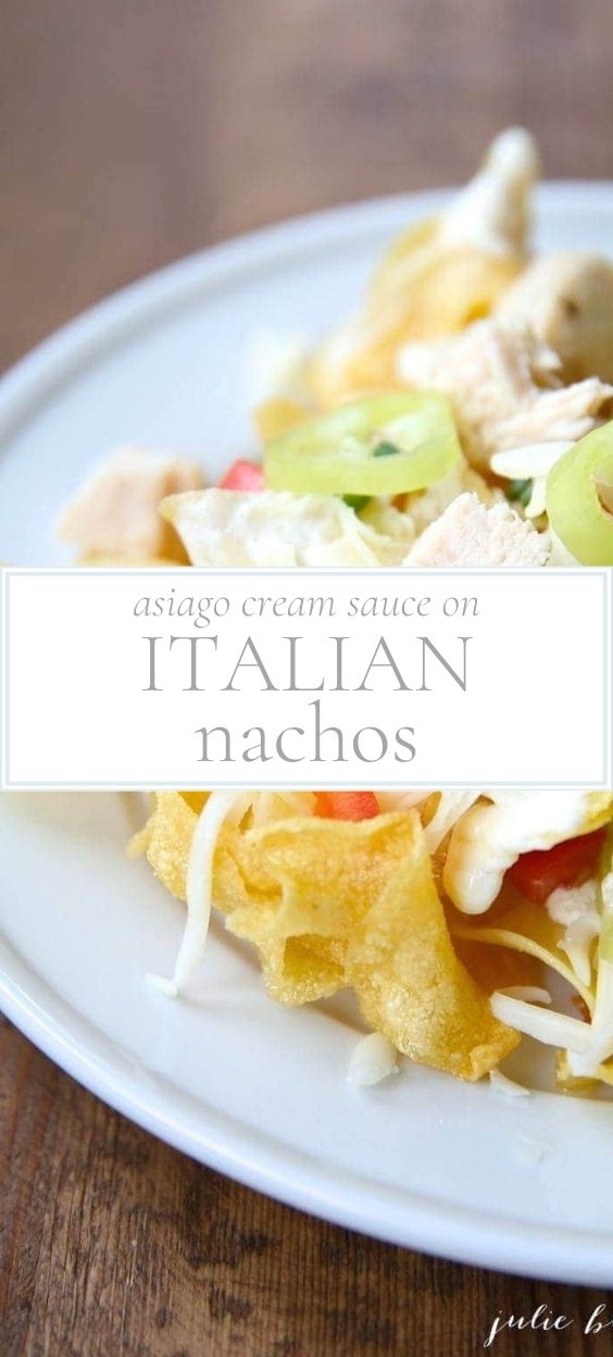 A white plate topped with Italian nachos
