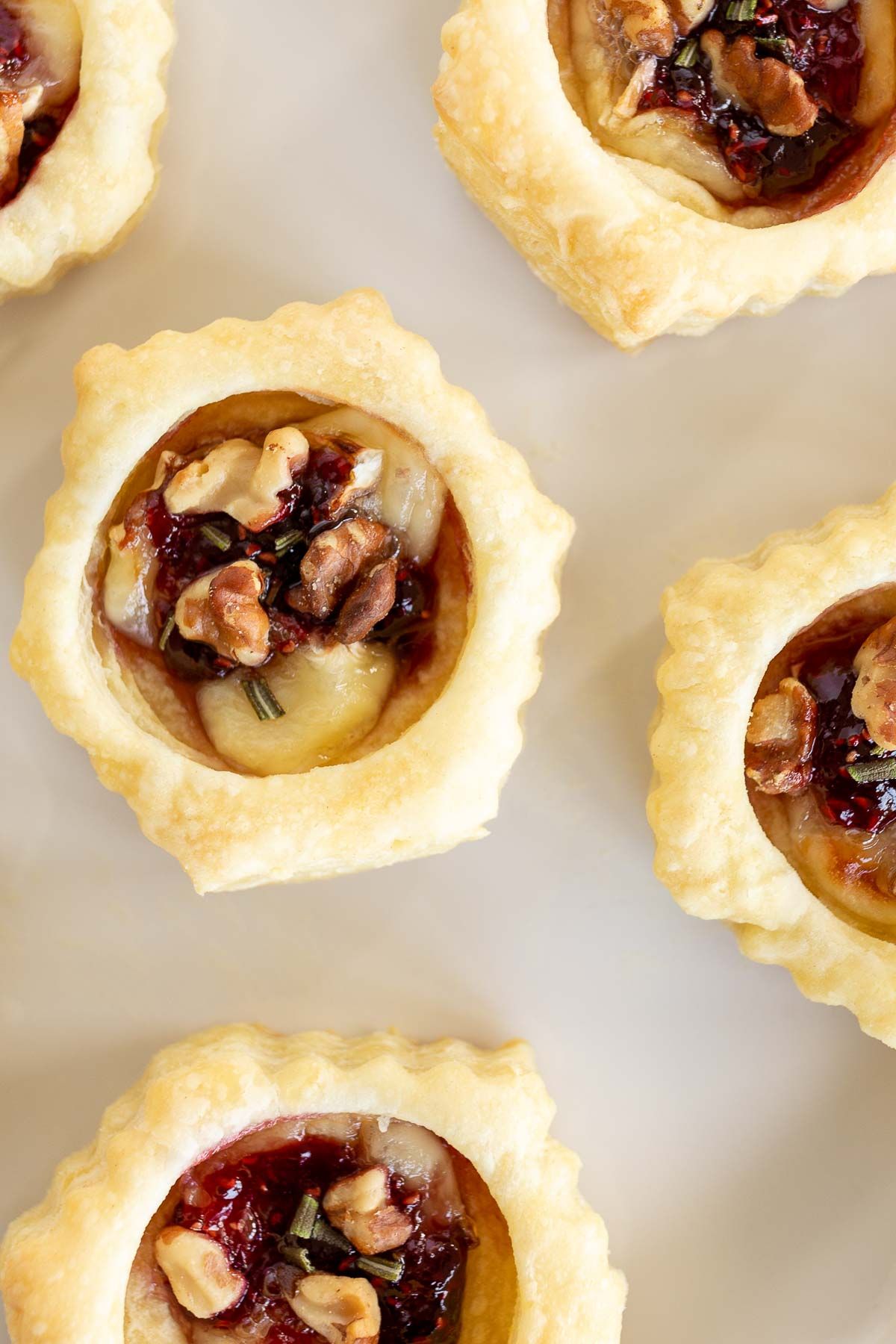 Brie bites puff pastry topped with pecans