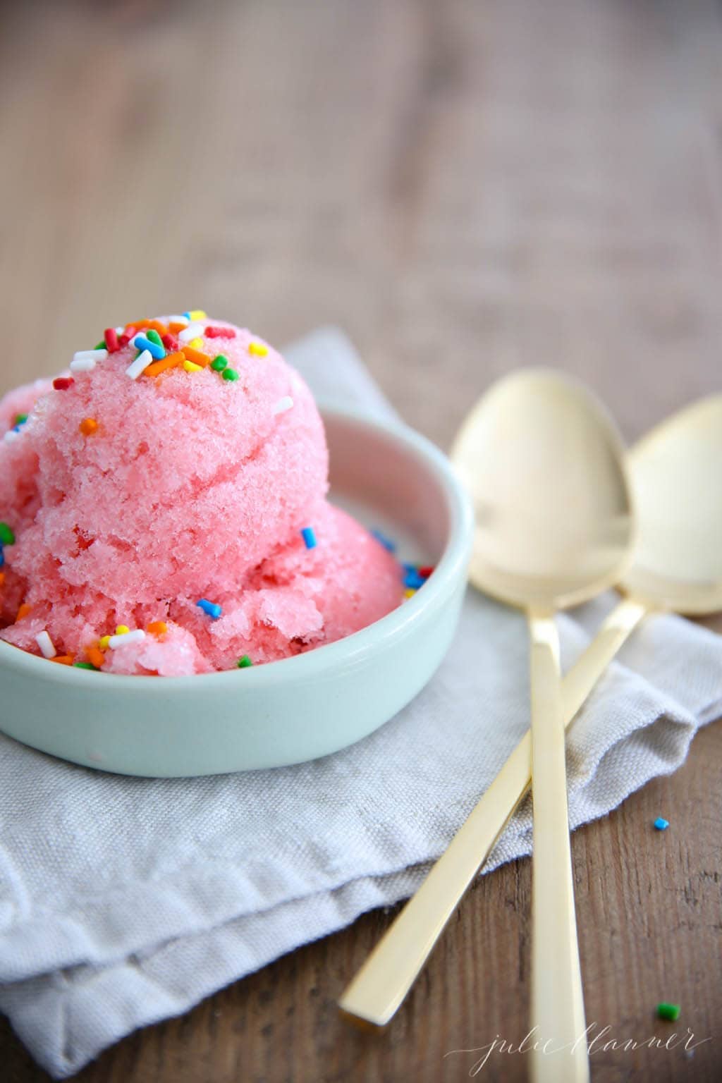 closeup of stawberry snow ice cream in a small dish