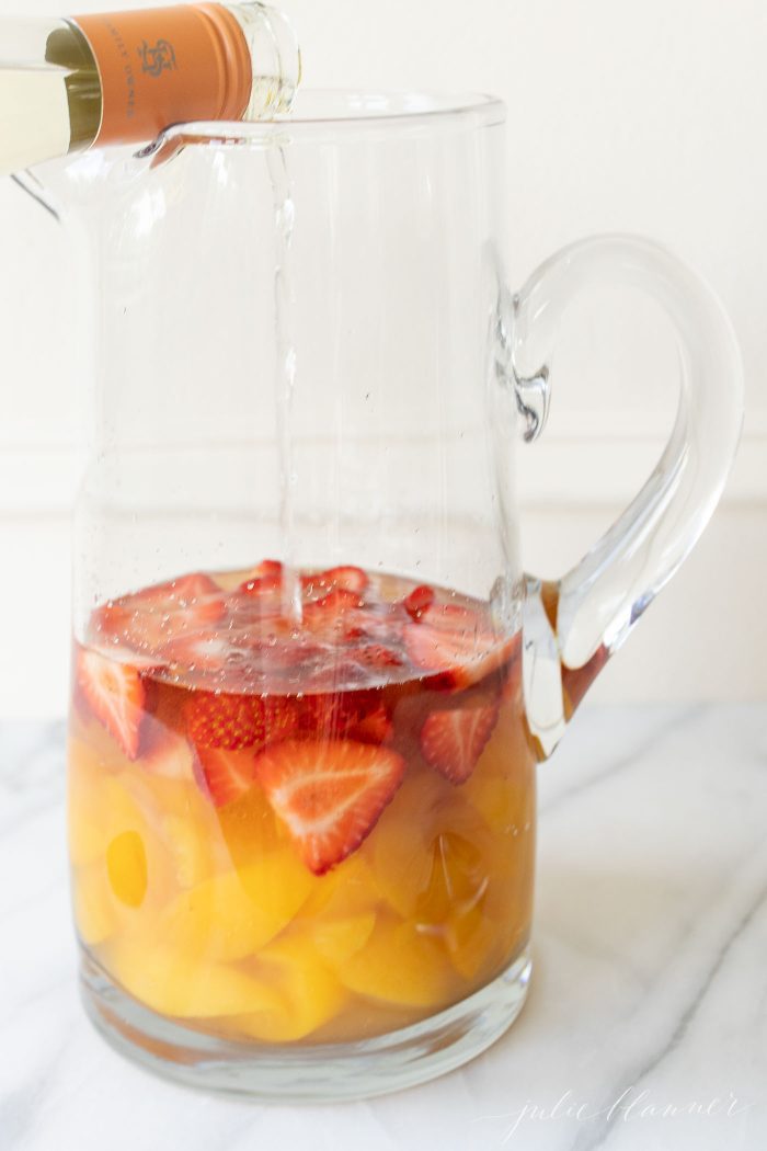 best white wine for sangria pouring white wine in pitcher