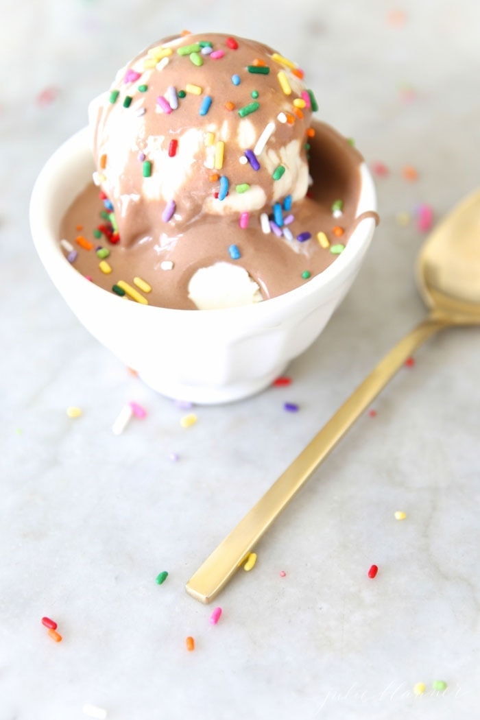 Chocolate sauce served with ice cream and sprinkles