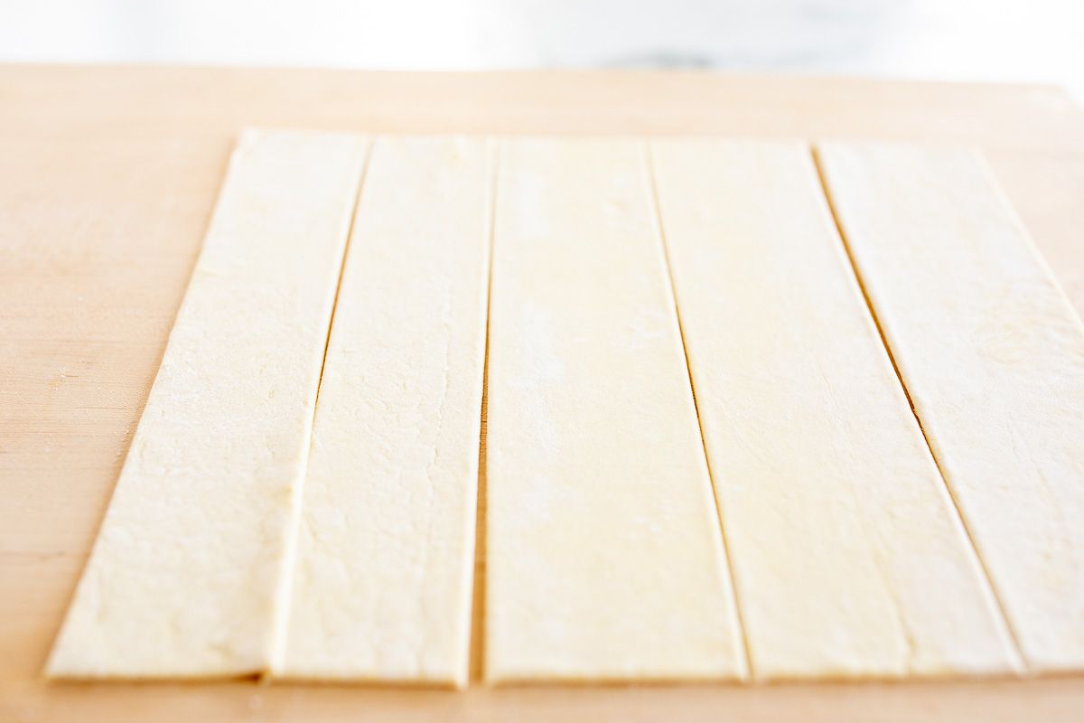 A sheet of puff pastry cut into strips