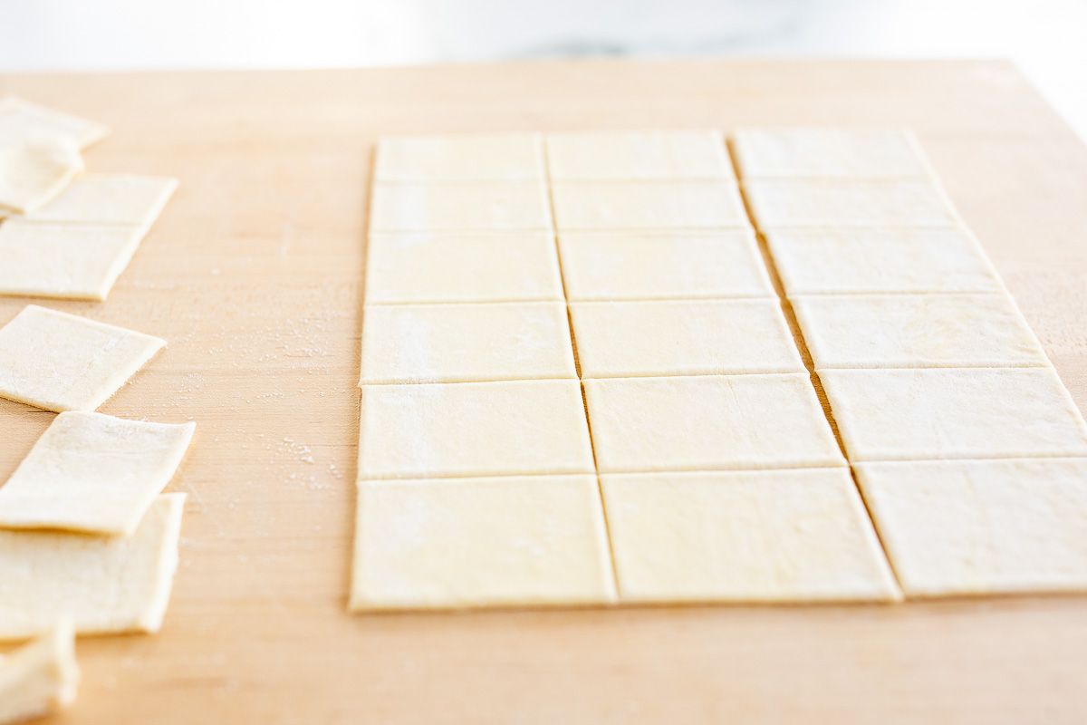 A sheet of puff pastry cut into squares