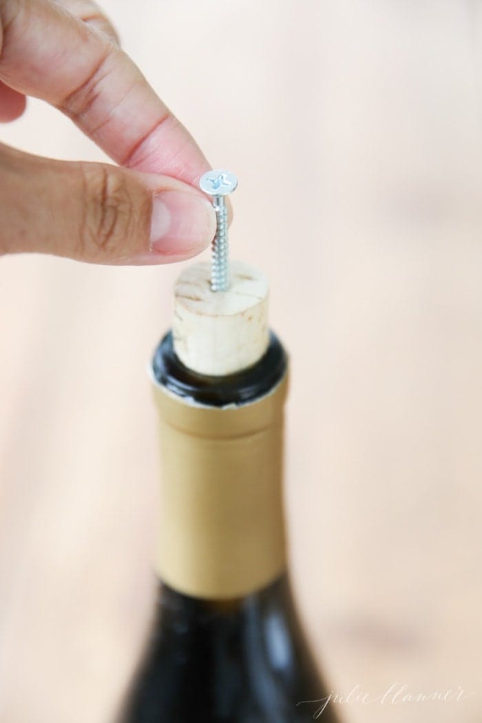 A nail in the top of a wine bottle cork.