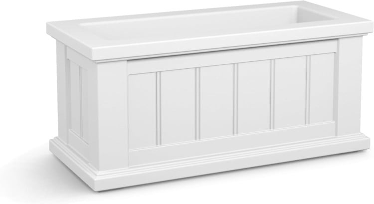 A white planter box with a wooden base