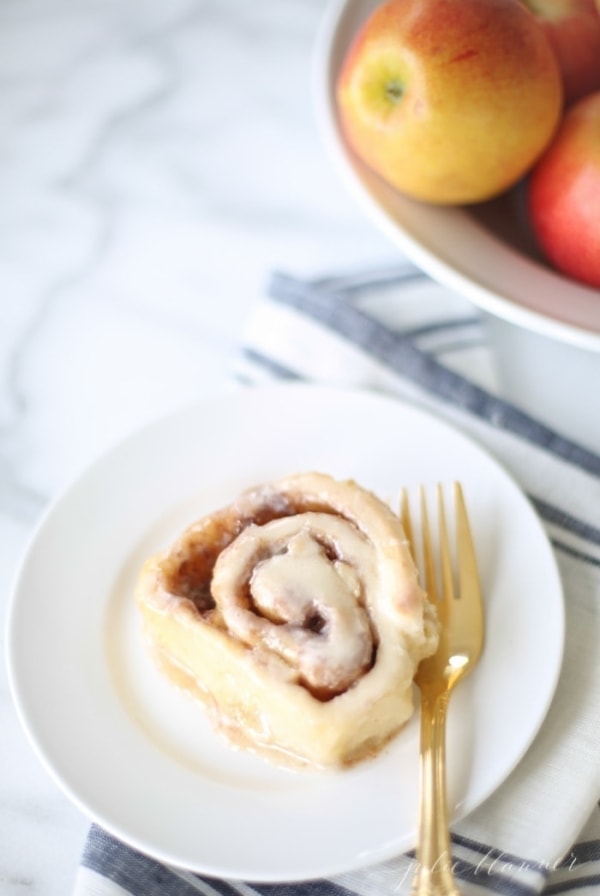 Easy apple cinnamon rolls recipe - get the secret to the lightest, fluffiest, better-than-the-bakery cinnamon rolls with creamy icing.