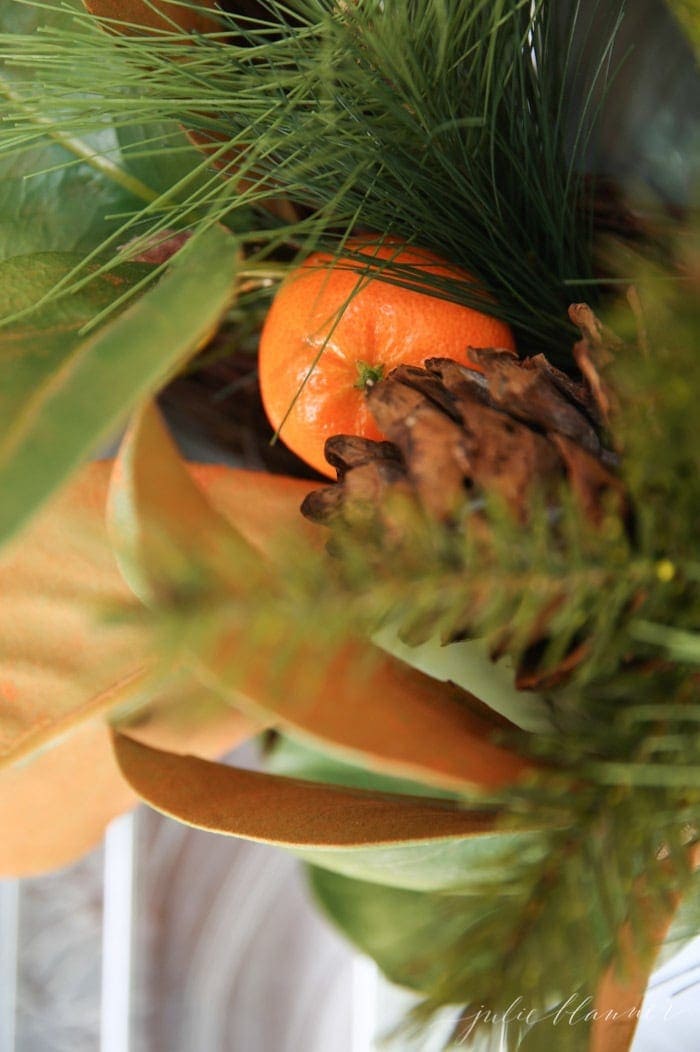 add life to a faux wreath this fall by adding fresh fruits or berries