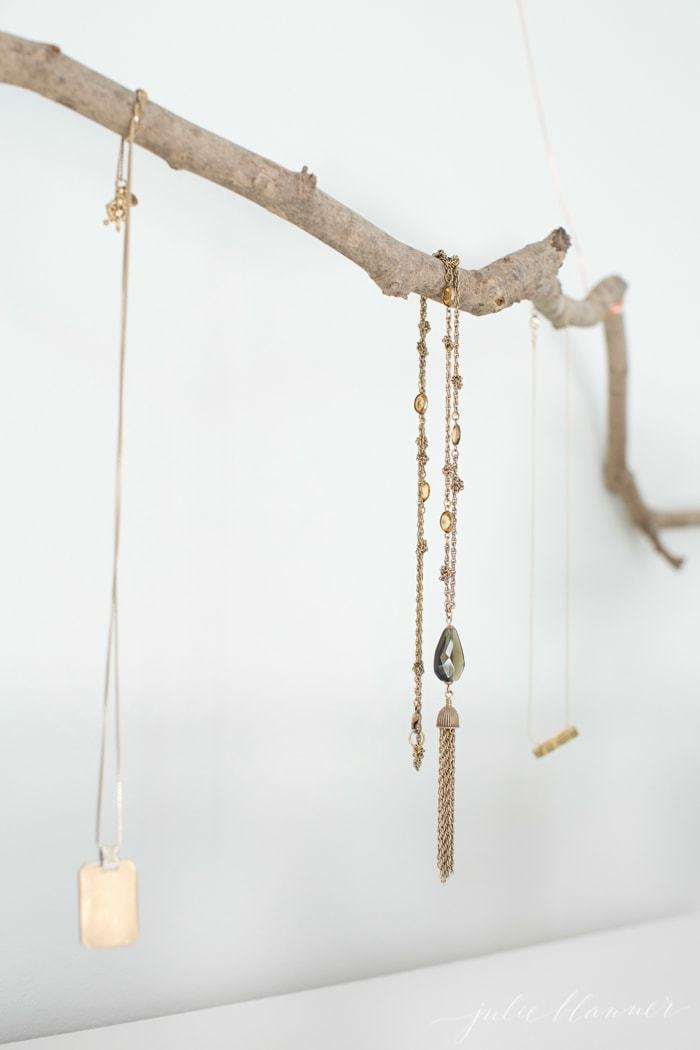 branch with necklaces hanging