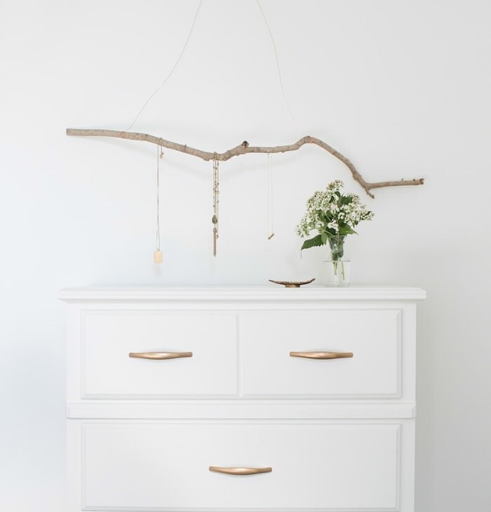 jewelry hanger over chest of drawers