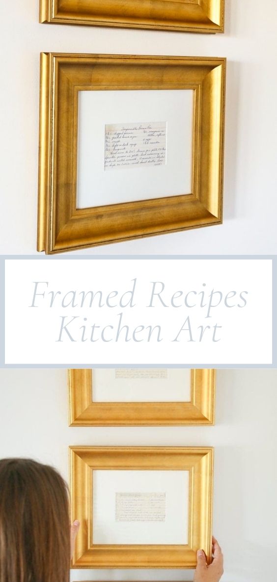 Recipe cards are hung on a white wall in golden frames.