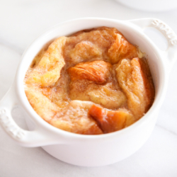 bread pudding in an individual, white baking dish