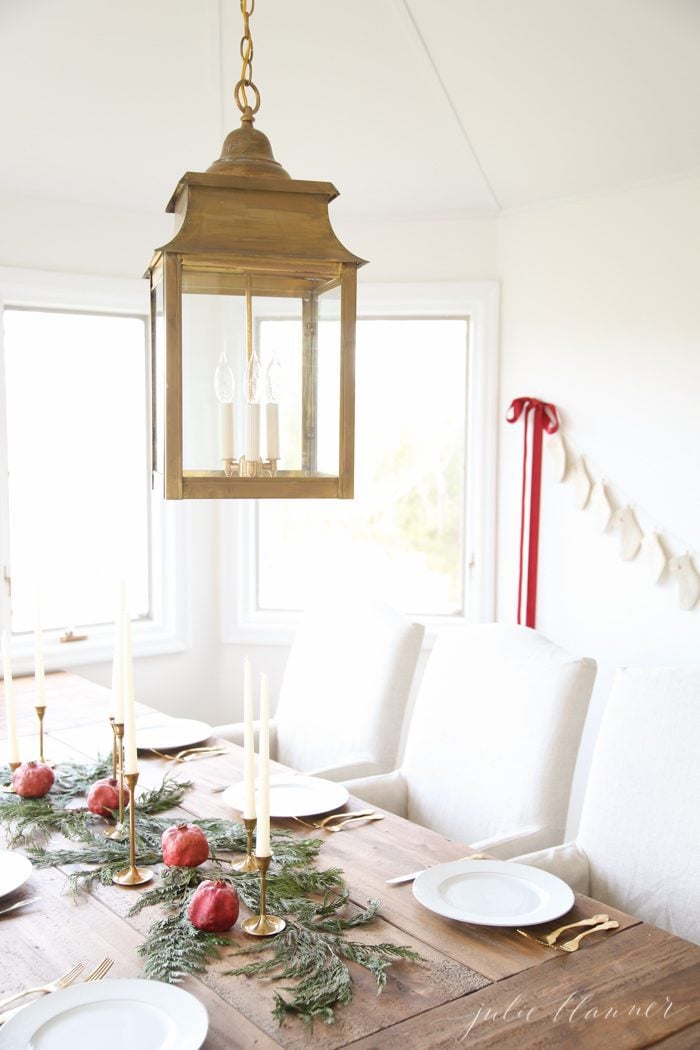 simple christmas table setting with gold lantern