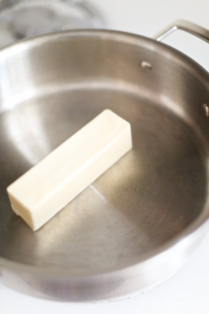 how to make peanut butter fudge - butter melting in a sauce pan