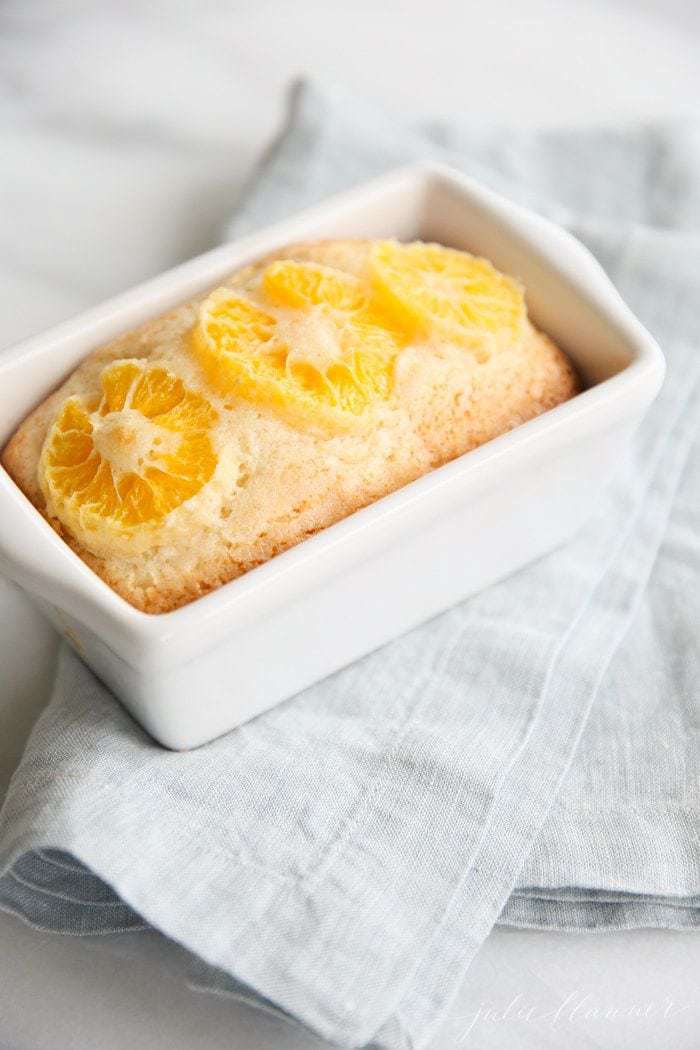 Orange slices on top of the risen baked bread