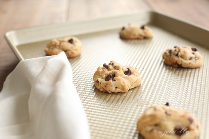 Cookies with chocolate chips on a sheet pan