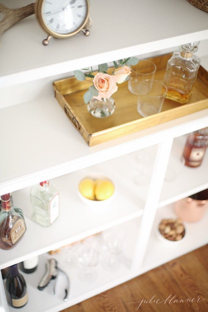 Lifestyle blogger Julie Blanner converted her built in bookcases into a beautiful bar cabinet