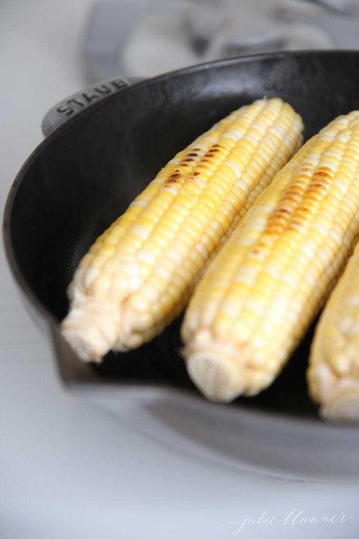 Stovetop Grilled corn on the cob in a cast iron pan