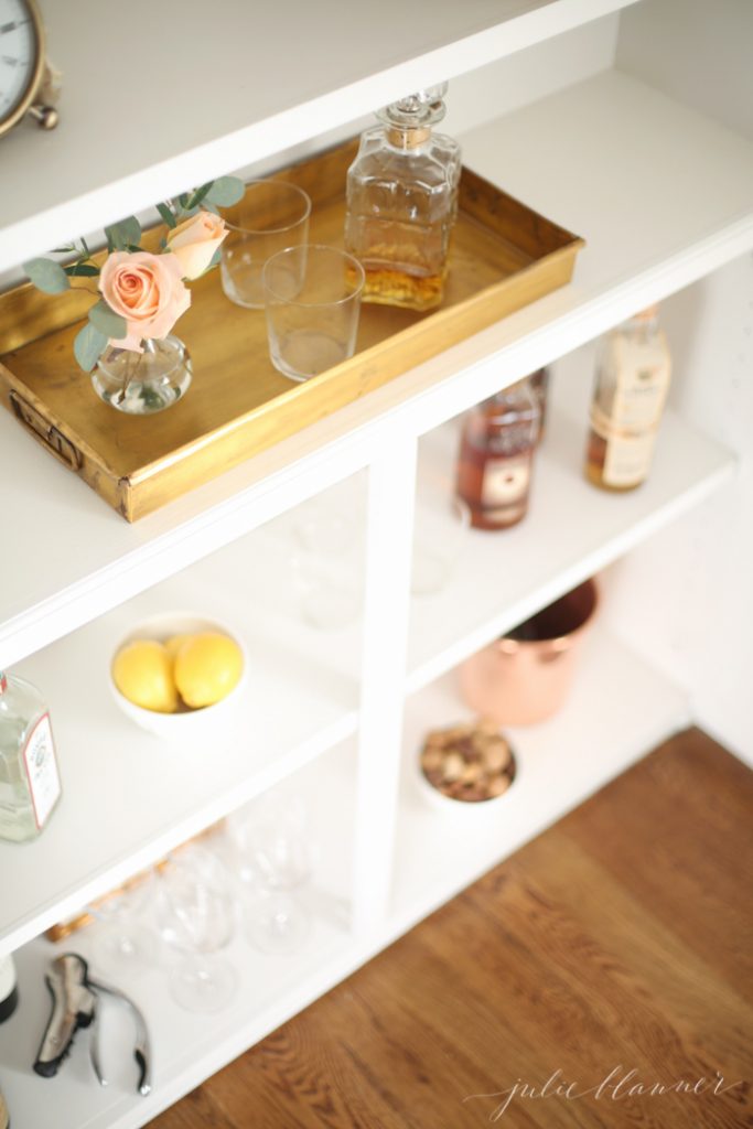 Entertaining blogger Julie Blanner converted her built in bookcases into a beautiful bar cabinet