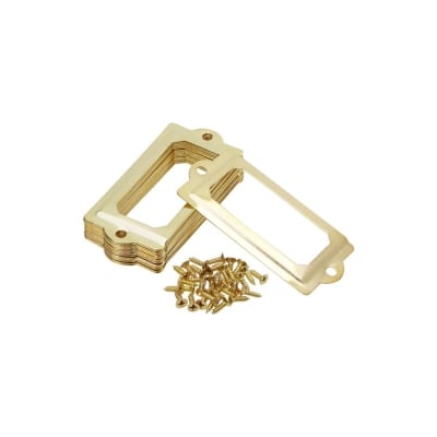 A pair of brass guitar pickguards with screws and nuts, perfect for organizing in a linen closet.