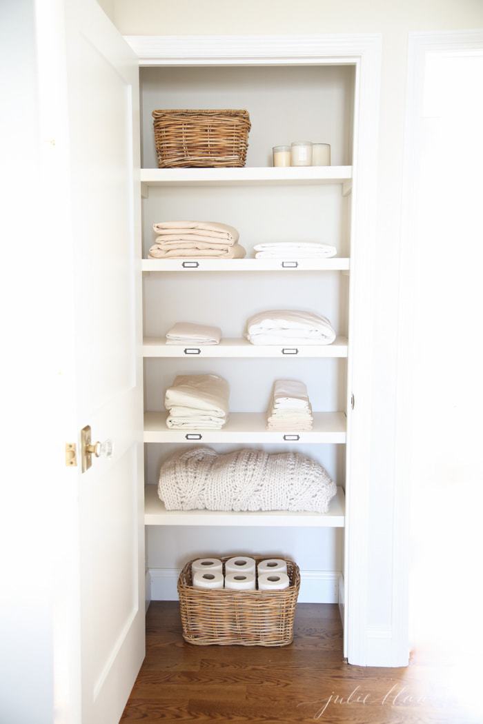 Easy Linen Closet Organization Ideas Julie Blanner - Standard Depth Of A Bathroom Linen Closet