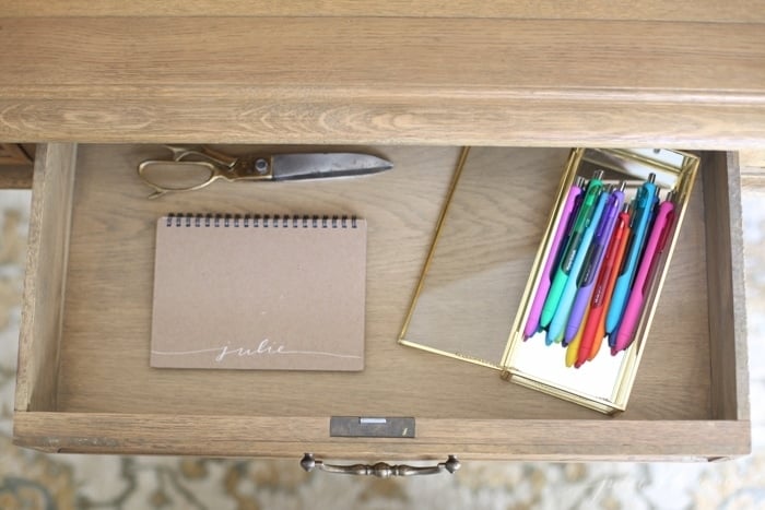 Inside a beautifully organized desk drawer with desk organization ideas.